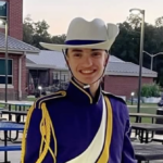 College marching band member in uniform